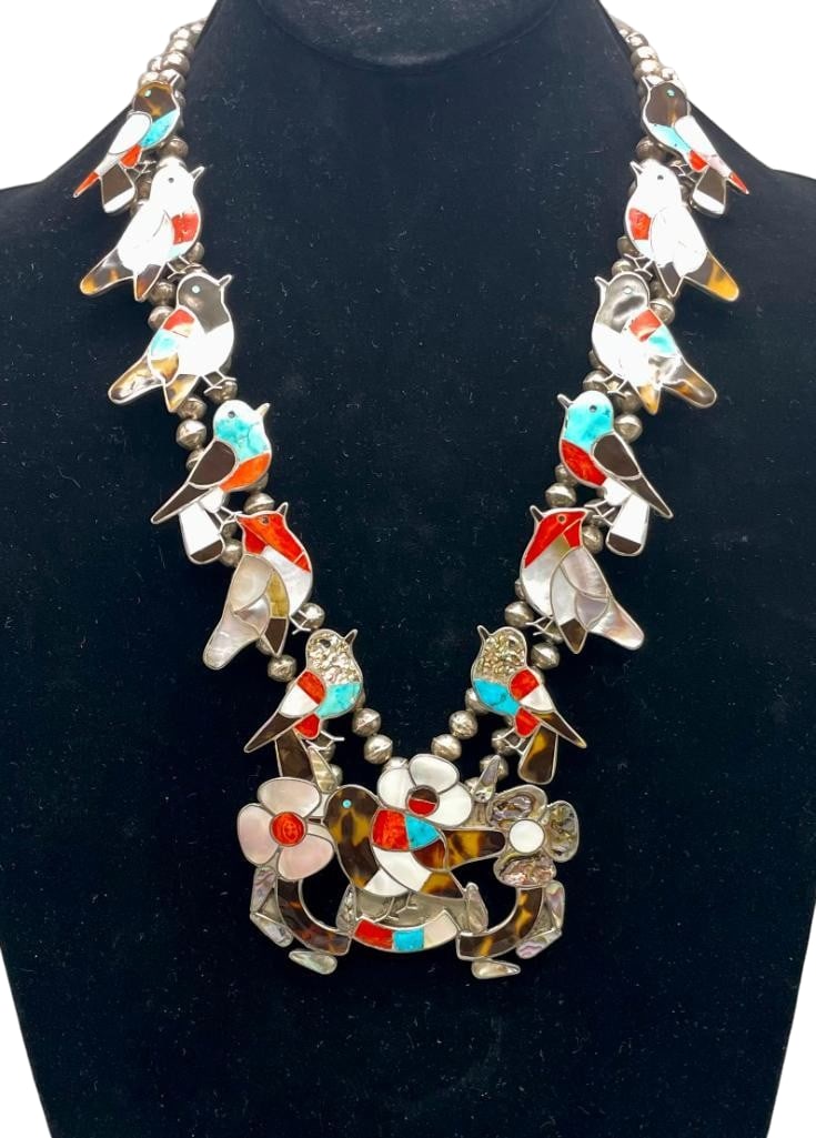 Vintage Bird Themed Zuni Inlay And Sterling Silver Squash Blossom Style Necklace: Offered here for your consideration is a vintage bird themed Zuni inlay and sterling silver squash blossom necklace. The central pendant showcases a bird themed channel inlay design of turquoise, cora