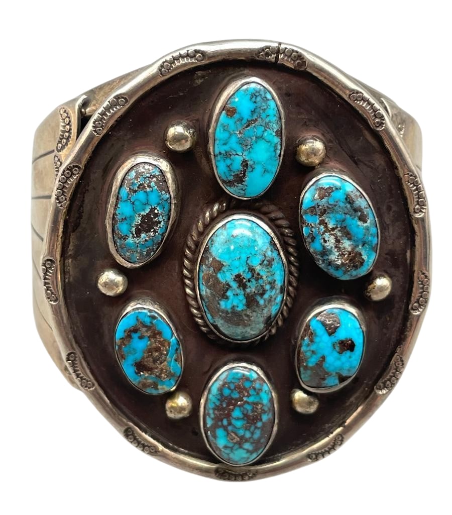 Seven Stone Nice Turquoise And Sterling Silver Bracelet: Offered here for your consideration is a seven stone nice turquoise and sterling silver bracelet. This piece features seven turquoise cabochons set in smooth silver bezels. Accenting the stones are si