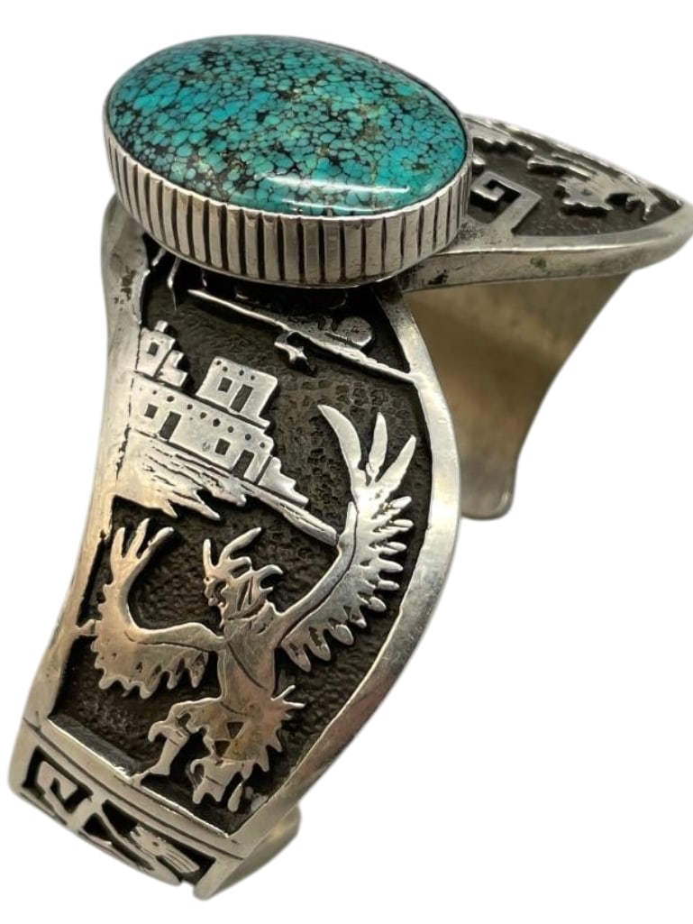 Sterling Silver Storyteller Overlay Bracelet With Nice Turquoise Stone: Offered here for your consideration is a sterling silver storyteller overlay bracelet with nice turquoise stone. This piece features a turquoise cabochon set in a smooth silver bezel accented with sto