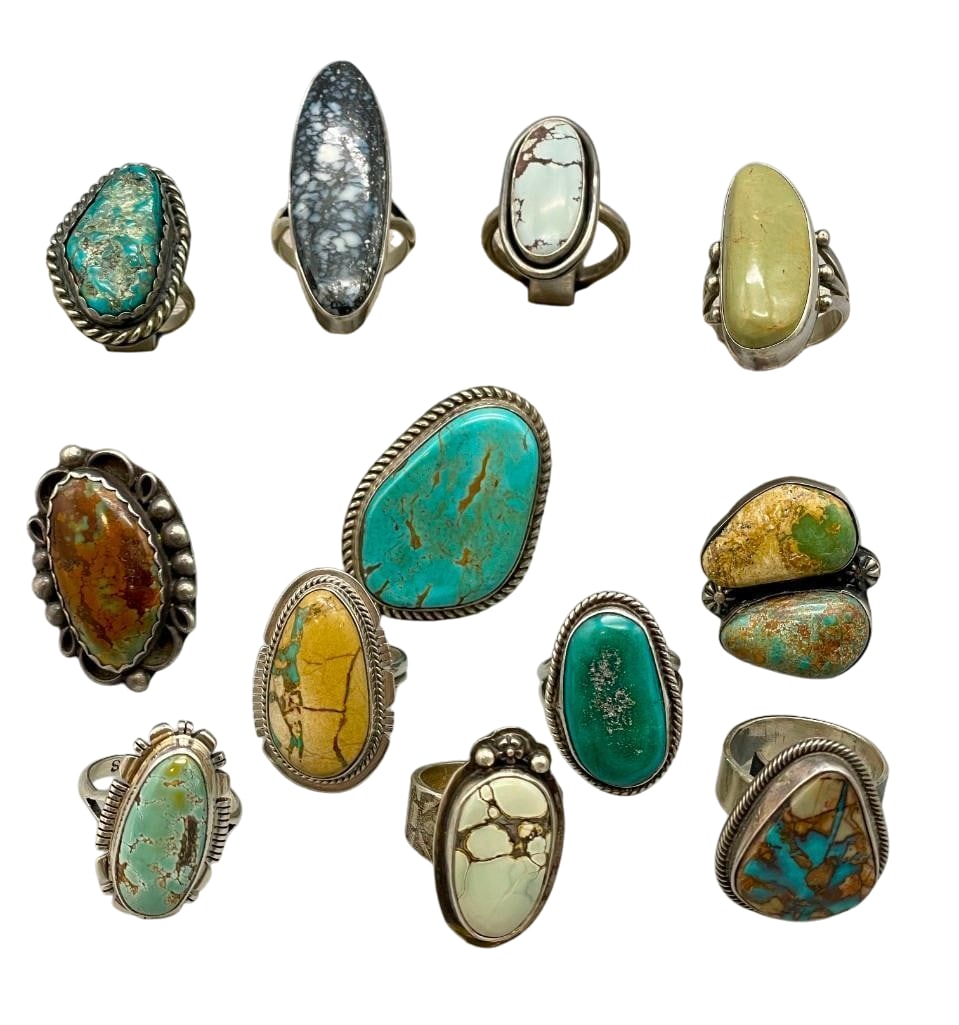 Group Of 12 Sterling Silver Rings With Various Turquoise Settings: Offered here for your consideration is a group of 12 sterling silver rings with various turquoise settings. Each piece features turquoise cabochons set in smooth or scalloped silver bezels. Accenting 