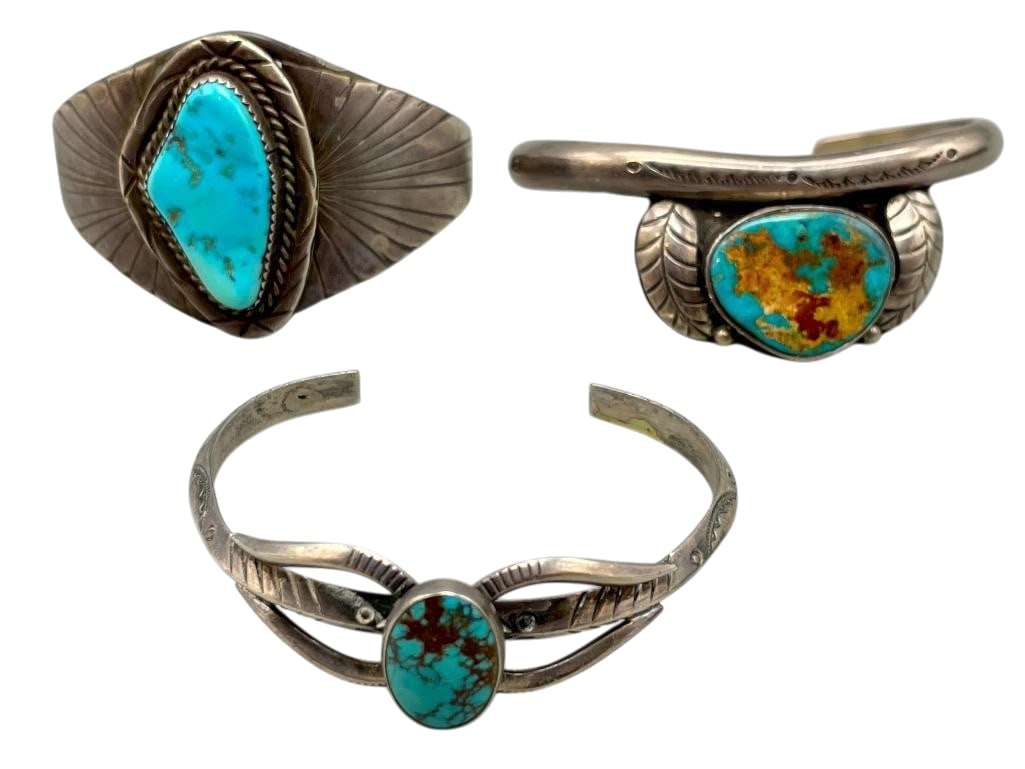 Three Sterling Silver And Turquoise Bracelets: Available here for your consideration are three sterling silver and turquoise bracelets. Each bracelet is highlighted with a nice turquoise cabochon set in a silver bezel. The stones are accented with