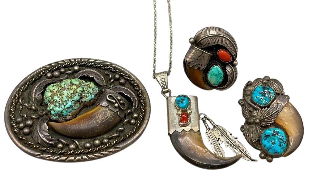Group Of Sterling Silver, Turquoise And Claw Items - Buckle, Ring, Pendant And Bolo Slide: Available here in this lot is a group of sterling silver, turquoise and claw items - buckle, pendant and bolo slide. These pieces are each highlighted with turquoise cabochons and claws set in silver.