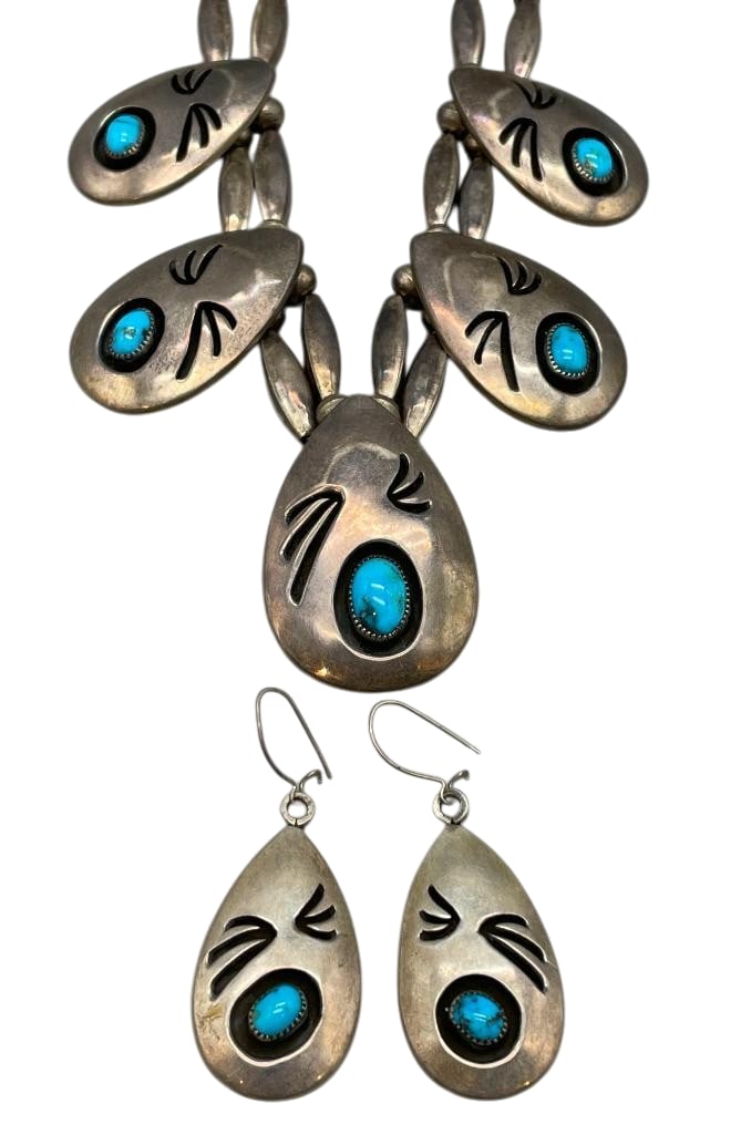 Sterling Silver And Turquoise Overlay And Shadow Box Style Necklace And Earrings By White: Offered here is a sterling silver and turquoise overlay and shadow box style necklace and earrings by White. This necklace features five pendants in graduated sizes each highlighted with a turquoise c