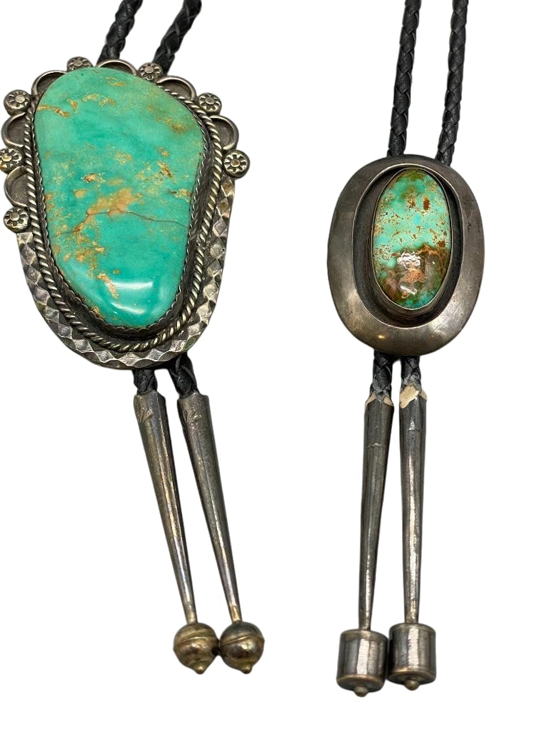 Two Nice Turquoise And Sterling Silver Bolo Ties: Available here for your consideration are two nice turquoise and sterling silver bolo ties. These bolos feature nice turquoise cabochons set in silver bezels. Silverwork of shadow box backgrounds,