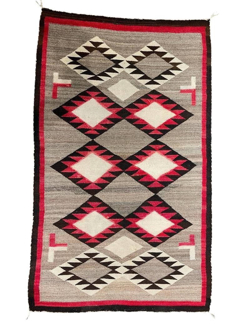 Vintage Non Regional Navajo Rug: Available here for your consideration is a vintage non regional Navajo rug. This rug is hand carded and hand spun wool featuring various diamond motifs in red, white and black. This pattern is set on 