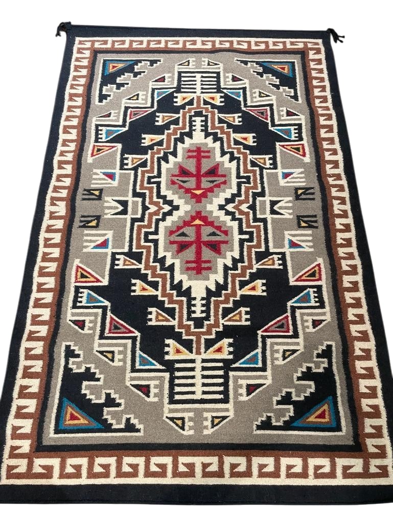 Teec Nos Pos Themed Zapotec Textile: Available here for your consideration is a Teec Nos Pos themed Zapotec textile. This weaving was made of wool on a foot pedal loom by weavers from the Oaxaca region in Mexico. The design replicates a 