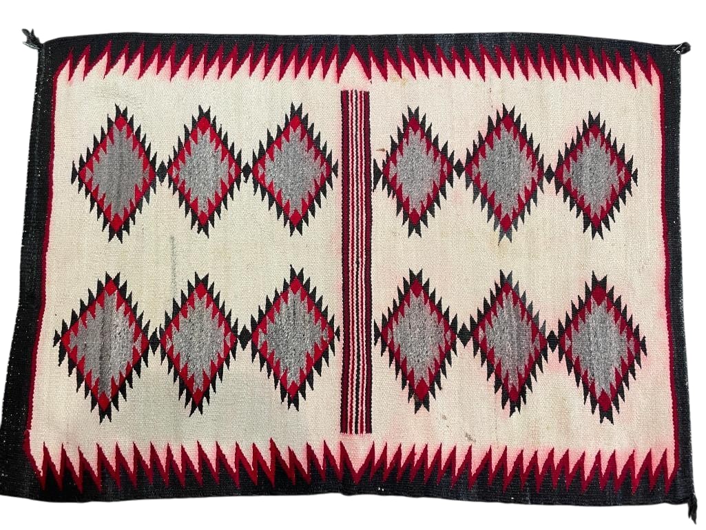 Non Regional Design Navajo Rug Circa 1950s: Available here for your consideration is a non regional Navajo rug from circa the 1950s. It was woven using hand carded and hand spun wool featuring a center band in red, black, and white. This is sur
