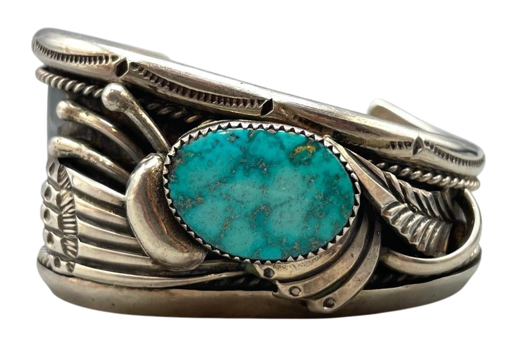 Nice Vintage Turquoise And Sterling Silver Bracelet: For your bidding enjoyment we present a nice vintage turquoise and sterling silver bracelet. This bracelet features a great turquoise cabochon set in a sawtooth silver bezel. Surrounding the stone are