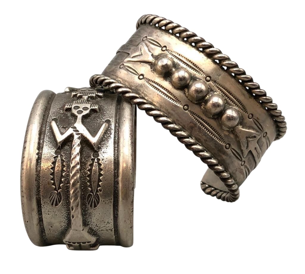 Two Wide Sterling Silver Bracelets: Available here for your consideration are two wide sterling silver cuff bracelets. The first bracelet features two Yei figural motifs accented with hand stamped design, darkened background and raised 