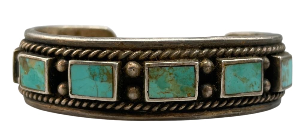 Hefty Vintage 10 Stone Turquoise Bracelet Circa 1930s-1940s: Offered here for your consideration is a hefty vintage bracelet dating to circa 1930s-1940s. This piece features 10 rectangular turquoise cabochons set in smooth silver bezels accented with silver dot