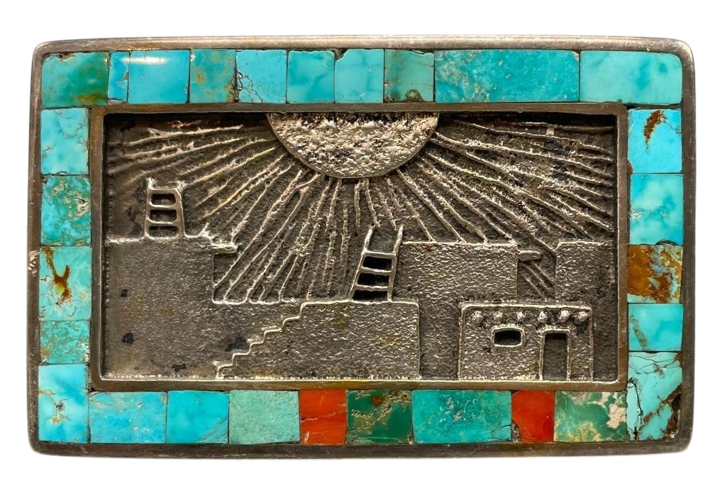 Sterling Silver Tufa Cast And Multi Stone Inlay Belt Buckle By Philander Begay: Presented here for your bidding pleasure is an amazing sterling silver buckle with an eye catching channel inlay design along the borders. The inlay features multiple settings of coral and turquoise. 