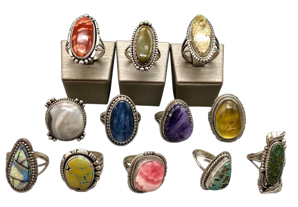 Group Of 12 Sterling Silver Rings With Various Stones: For your bidding pleasure we present a group of 12 sterling silver rings with various settings including turquoise and other stones set in smooth or scalloped silver bezels. Accenting the cabochons ar