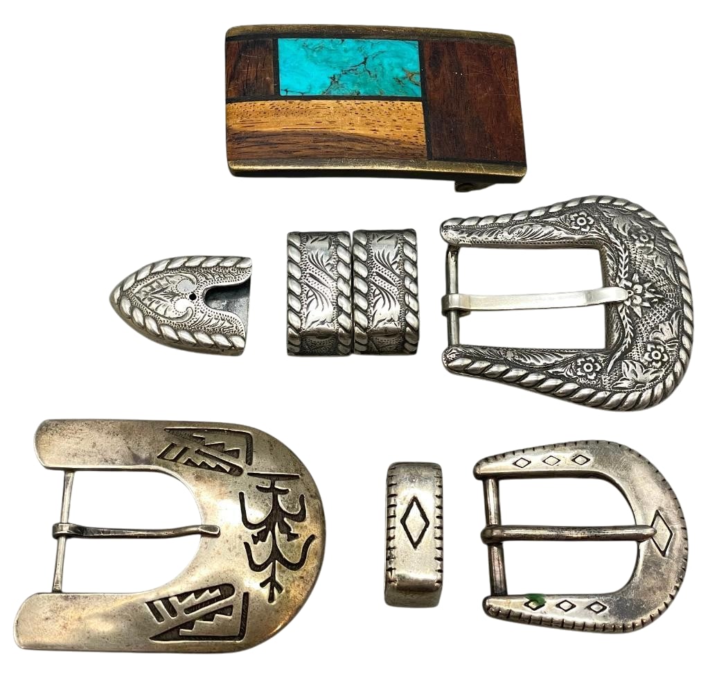 Three Sterling Silver Buckles And One Inlay Buckle: For your bidding pleasure we present three sterling silver buckles and one inlay buckle. Three of the buckles feature silver designs including hand stamped or overlay style styles on darkened silver b