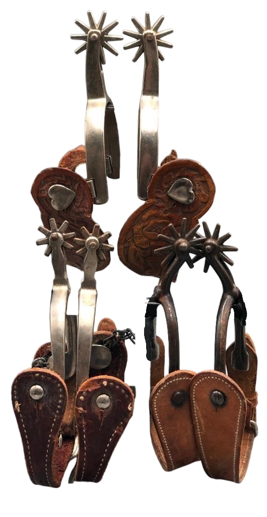 Three Pair Of Vintage To Antique North And Judd Spurs: Available here for your consideration are three pairs of vintage to antique North and Judd spurs in various styles of shanks and rowels and each pair comes with spur straps. One pair has heart shaped 