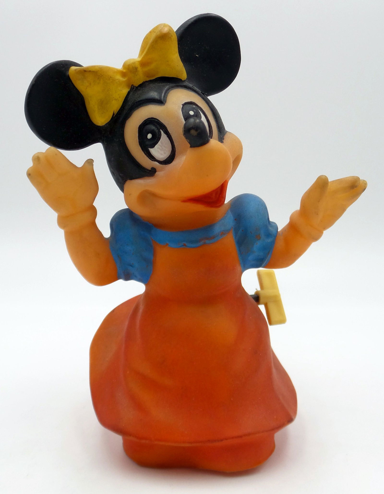 Vintage European DISNEY Minnie Mouse Wind-Up Toy: Measures 5.75" tall. Ca. 1960, made from thick rubber. Minimal damage to finger tips. Winds-up and turns.