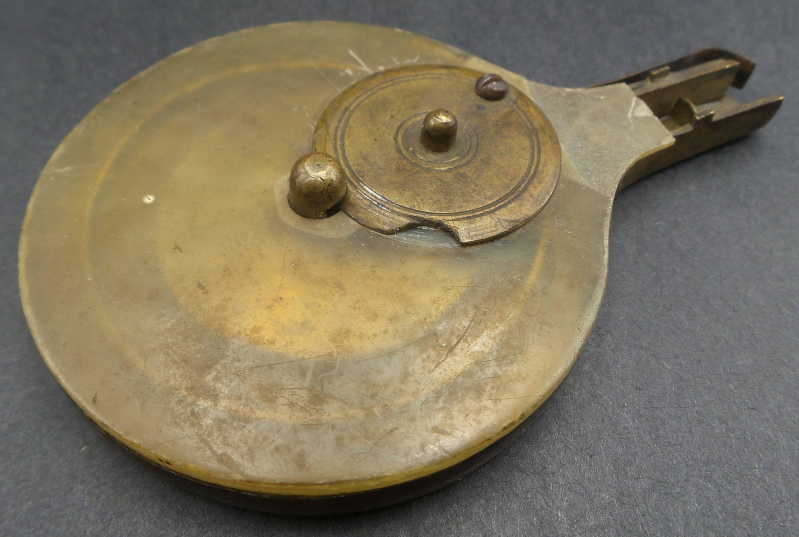 Antique 18th Cent. European Brass & Horn Pistol Bullet Case: Rare piece. Can be opened to refill bullets which run along the "snail" inside and are dispensed through the front piece. Brass and hand carved horn. Measures approx. 3 1/2" long x 2 1/4" wide. Good c