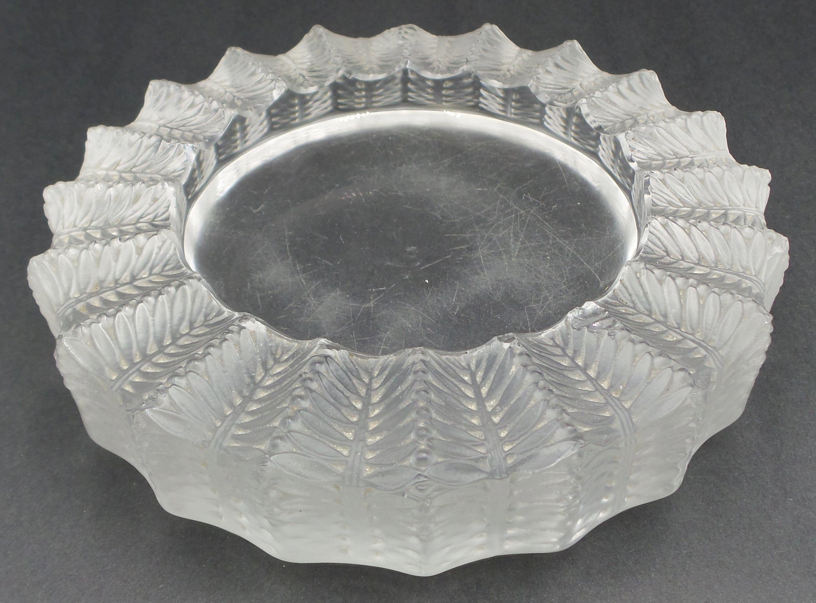 Vintage LALIQUE France Frosted Art Glass Ashtray: Measures approx. 5 1/2" in diameter x 1 1/8" high. Good vintage condition with no cracks or repairs. Chip to rim. Signed on bottom.