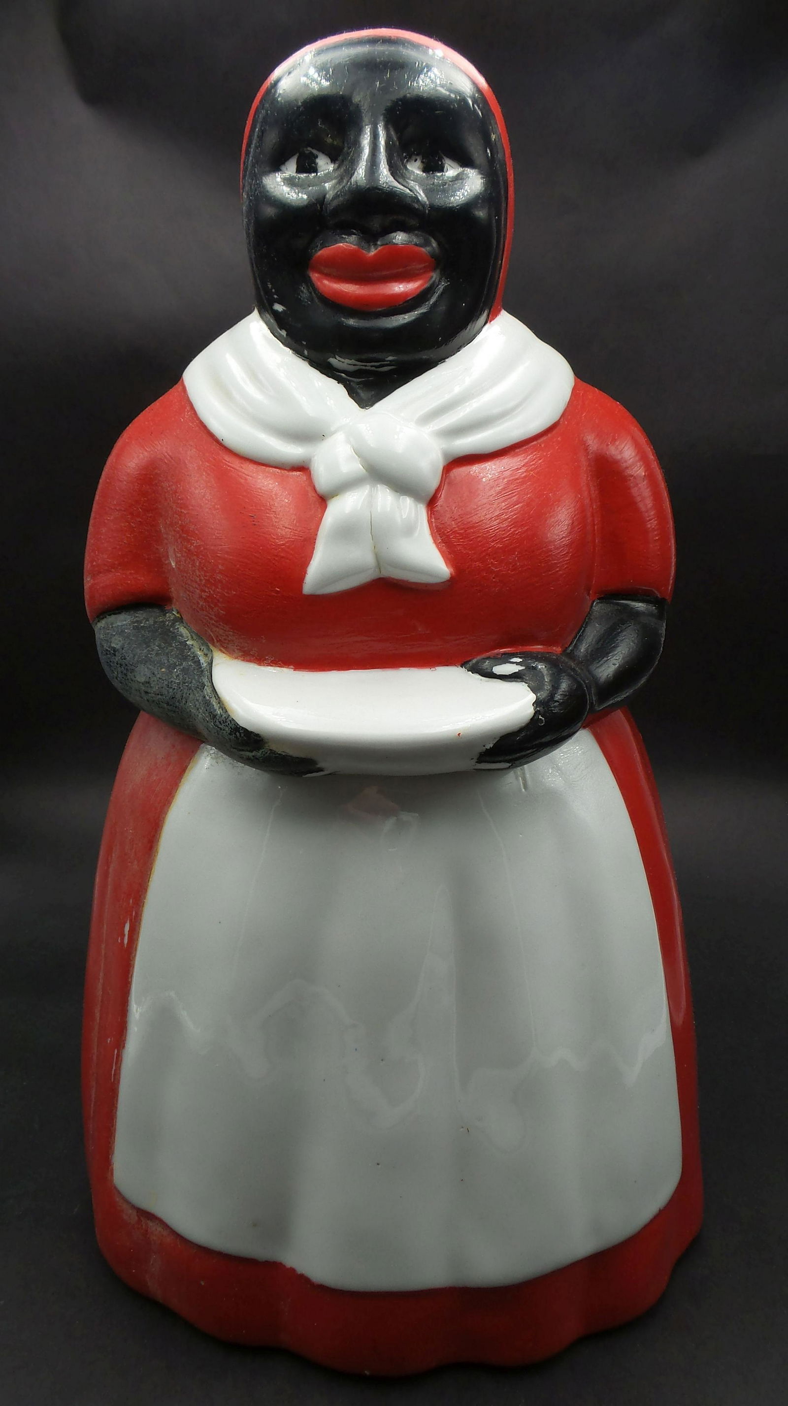 Vintage IAC Black Americana Mammy Ceramic Cookie Jar: Very colorful piece with a great presence. Measures approx. 11" high. Minor paint loss. Needs some cleaning.