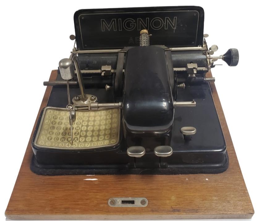 Antique AEG Germany MIGNON Typewriter: Measures approx. 13" long x 13" wide (base) x 8 1/2" high. Good antique working condition with some wear according to age. Case lid is missing.