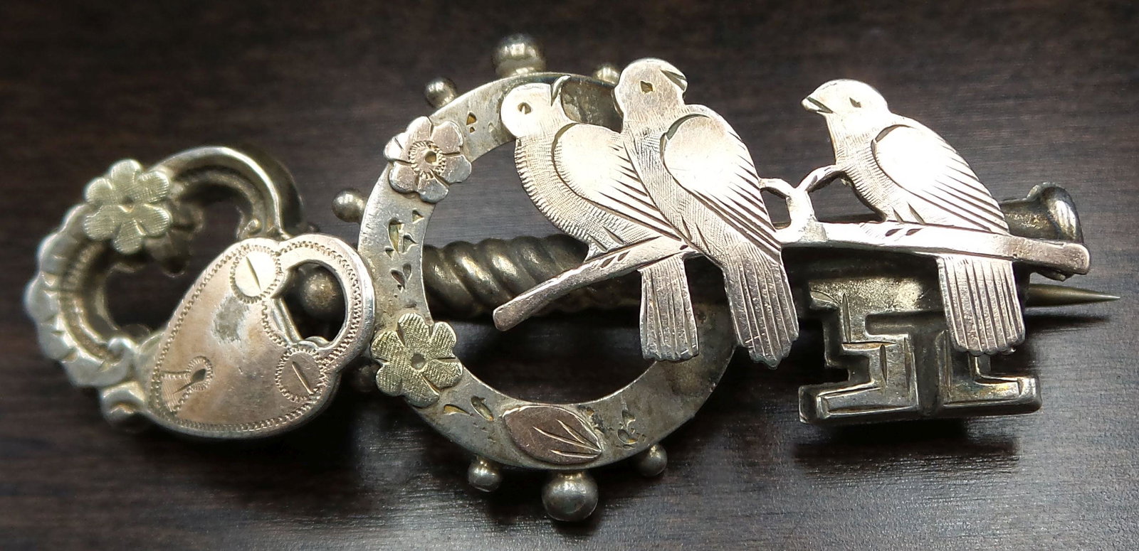 Antique ca. 1905 British Sterling Silver Key Brooch: Very good antique condition. Measures approx. 2" long and weighs ca. 5 grams. Fully hallmarked.