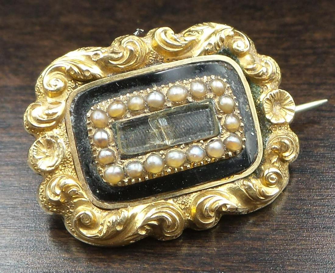 Antique Victorian 14K Gold, Black Enamel, Pearl & French Hair Art Mourning Jewelry Brooch: A stunning antique mourning/sentimental locket front brooch. Crafted in solid 14K gold. The brooch features a tiny glass compartment and ornate gold repousse work against a jet black enamel background