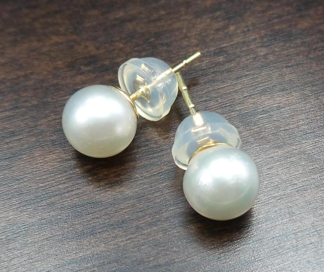 Pair of New 14K Gold & Japanese Akoya Pearl Stud Earrings: These beautiful pieces are brand new, feature 14K gold studs, cultured Japanese Akoya pearls with a diameter of approx. 1/4", and comfortable silicone closures. Each piece measures approx. 9/16" long