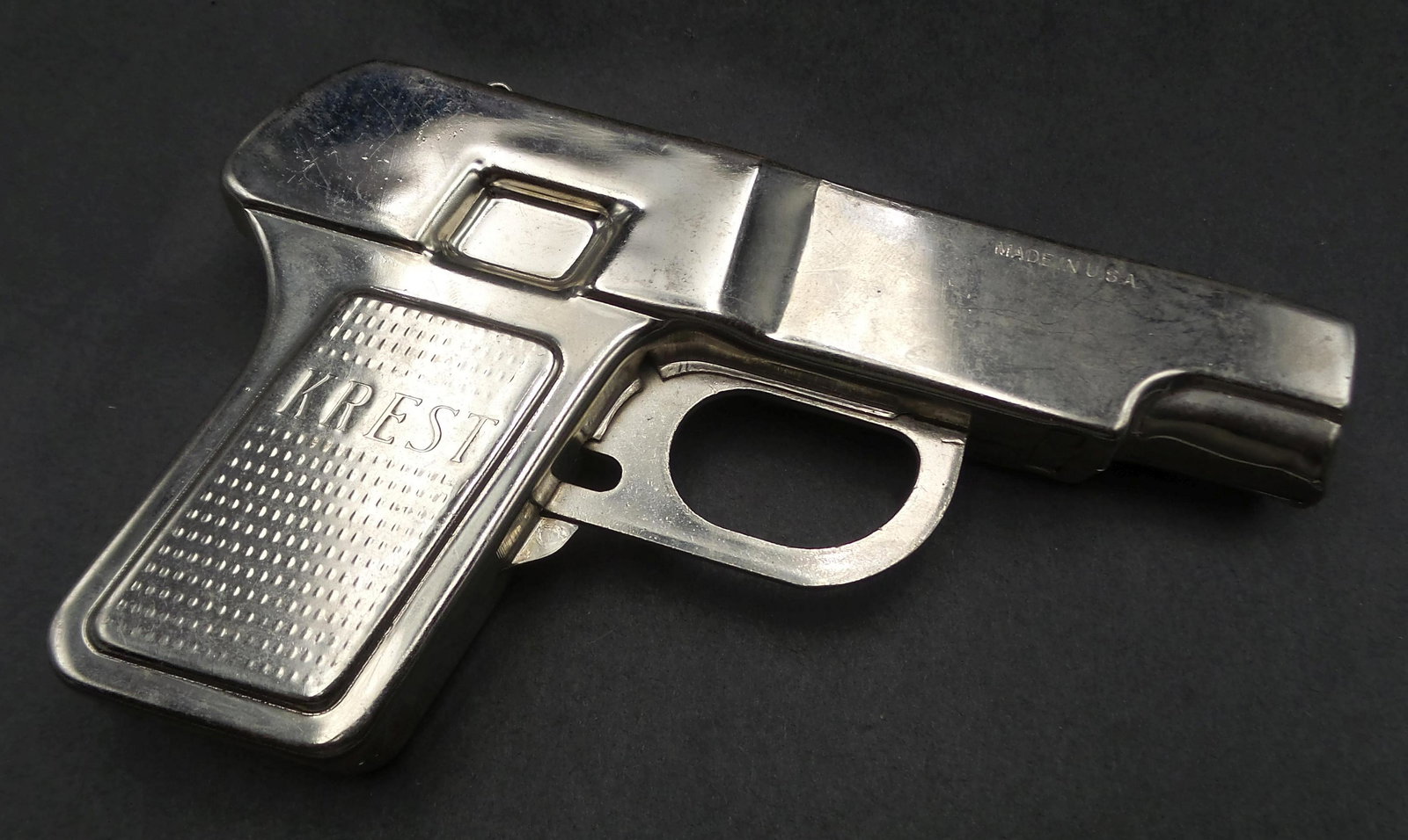 Rare 1940s KREST Spring Loaded Marble Shooter Toy Gun: Good condition with wear according to age. Measures approx. 5 1/2" long.
