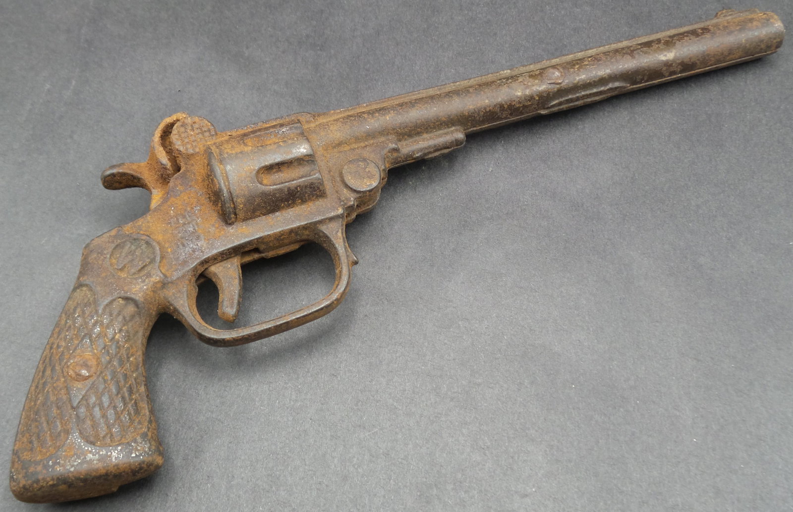 Antique Cast Iron Cap Gun Toy marked "SUPER": Good condition with wear and some surface corrosion according to age. One chip at the base of the grip. Measures approx. 8 1/2" long. Works.