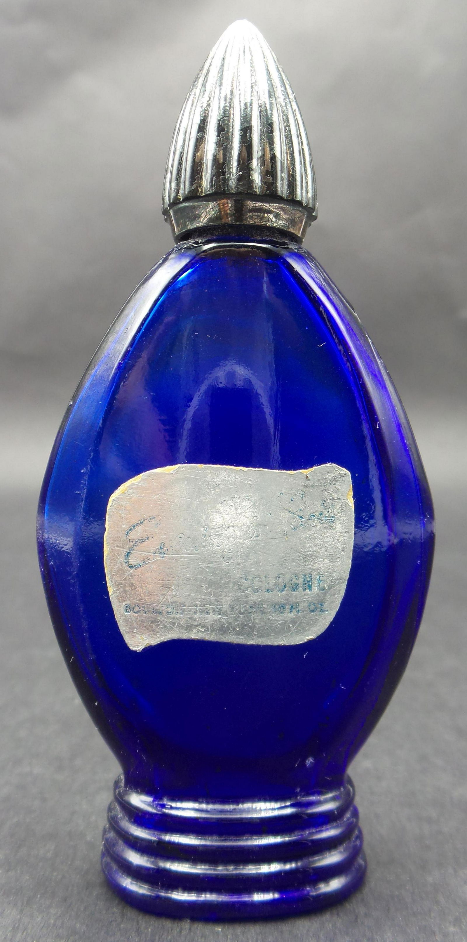 Vintage BOURJOIS EVENING IN PARIS Cobalt Blue Perfume Bottle: Measures approx. 3 3/4" tall x 1 3/4" wide. Very good vintage condition with no chips or cracks.