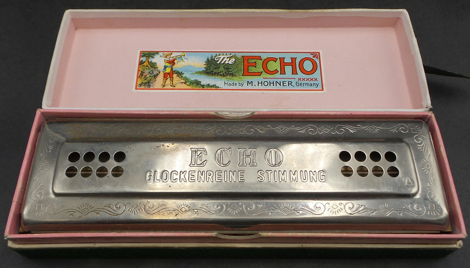 Vintage 1940s HOHNER Germany "Echo Harp" Harmonica in orig. Case: Good vintage condition, ca. 1930 - 1950, minor surface rust acording to age (can be polished away). Measures approx. 7" long x 2 1/2" wide. Tuned "AD".