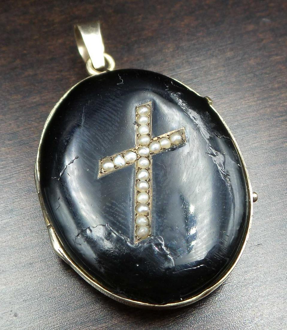 Ca. 1850 European 14K Yellow Gold, Seed Pearls & Black Enamel Cross Faith Locket: This great piece measures approx. 1 1/4" high x 7/8" wide and weighs ca. 10.8 grams. Tested for 14K gold. Good antique condition, some enamel loss on the front. Still has the original photographs of a