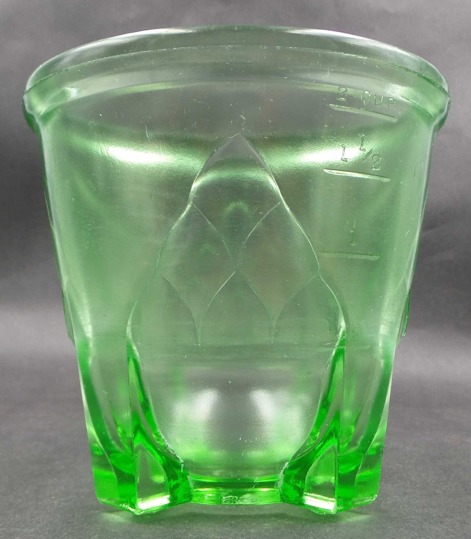 Vintage 1930s Art Deco HAZEL ATLAS Vaseline Uranium Glass Measuring Pitcher: Vintage 1930s green vaseline uranium depression glass measuring cup by Hazel Atlas in excellent condition. This uranium glass 2 cup measure was originally the base for a hand held egg beater. Although