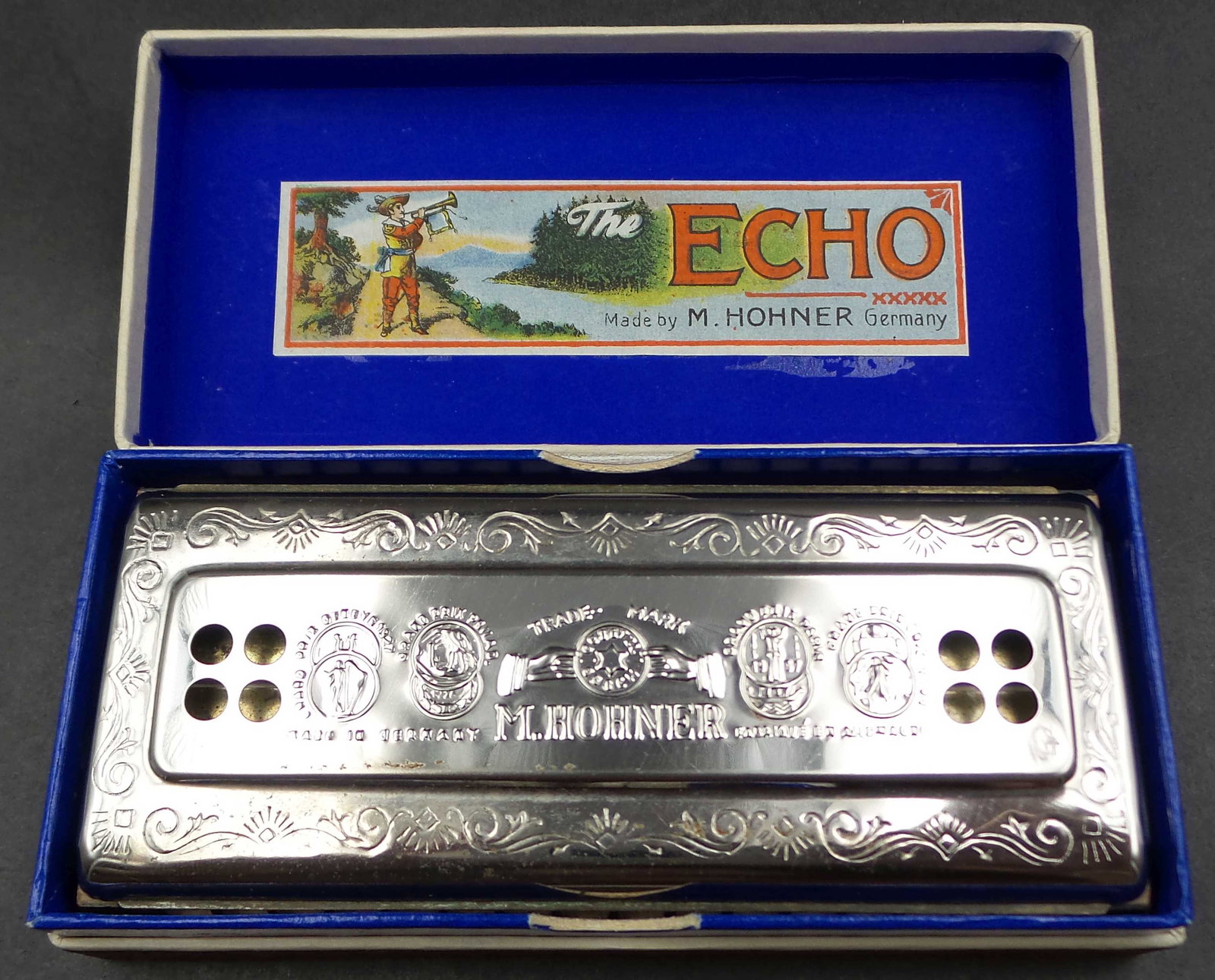 Vintage HOHNER Germany 54/64 Echo Harp Tremolo Harmonica - Key of C & G: The Hohner Echo Harp 54/64 C/G harmonica can be used for playing in both C and G keys. This instrument is characterized by a warm and deep sound and high-quality craftsmanship. It is popular among tra