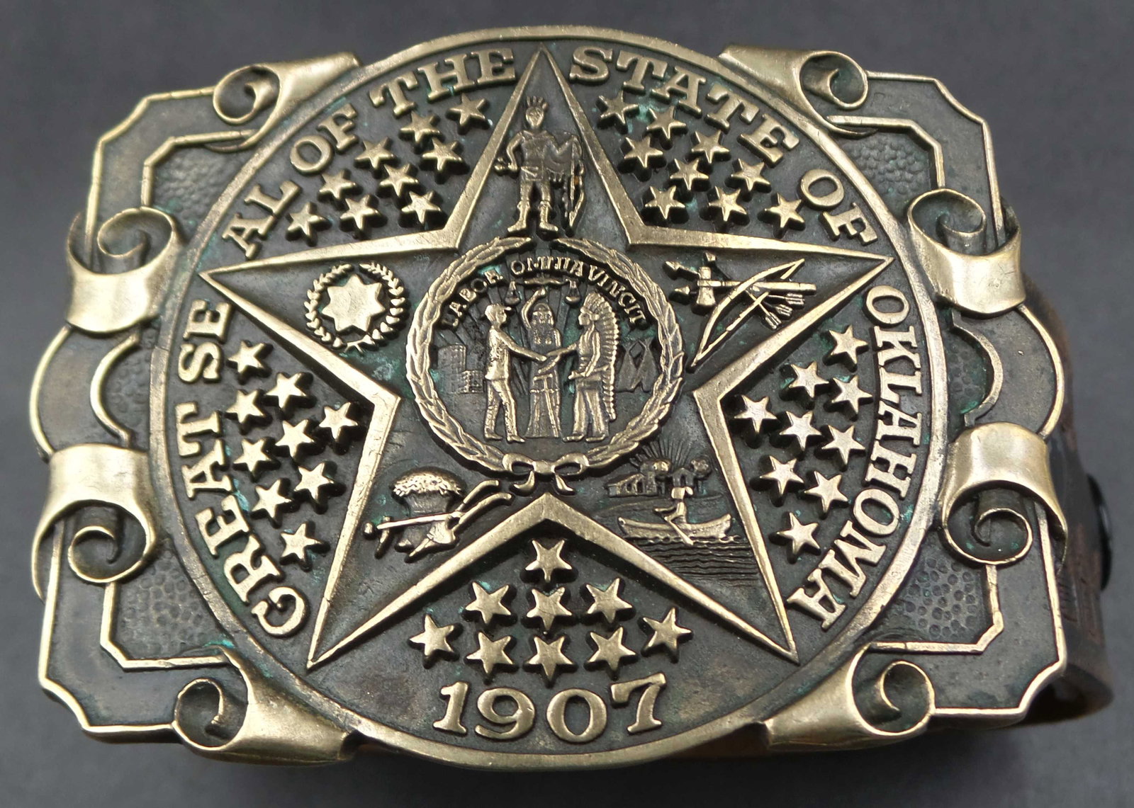 Vintage BERGAMOT BRASS WORKS State Seal of Oklahoma Brass Belt Buckle w/ Embossed Leather Belt: Very stylish high-quality belt and buckle. The buckle measures approx. 3 5/8" long x 2 5/8" high. The belt is hand embossed, made from real leather, is a size M (adjusts between 34-36), and is 1 5/8" 