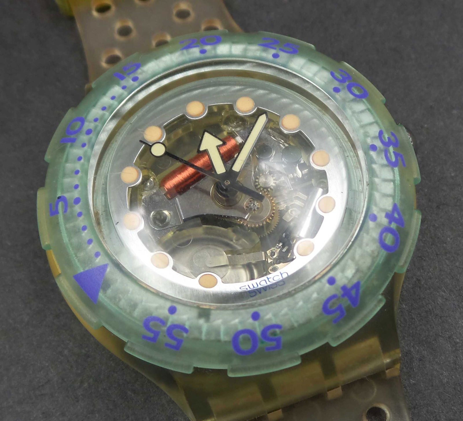 Vintage 1992 SWATCH SDK107 "Blue Ice" Diving Watch: This beautiful 1992 Swatch Scuba watch model comes with such an exciting skeleton dial design. Powered by a Swiss quartz movement, the watch keeps perfect time.The water-resistance is up to 20 bar / 2