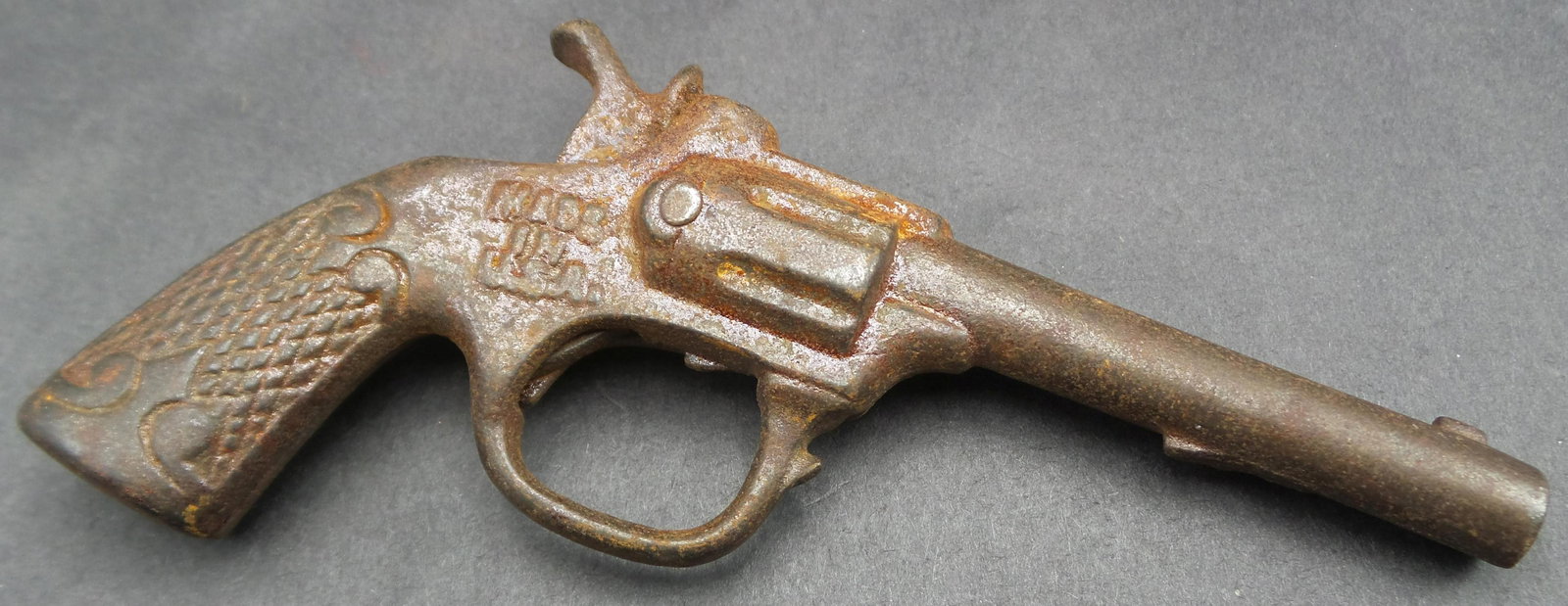 Vintage 1930s KING Miniature Single Action Cast Iron Cap Gun Toy: Good condition with wear and somesurface corrosion according to age. Measures approx. 4 3/4" long. Works.