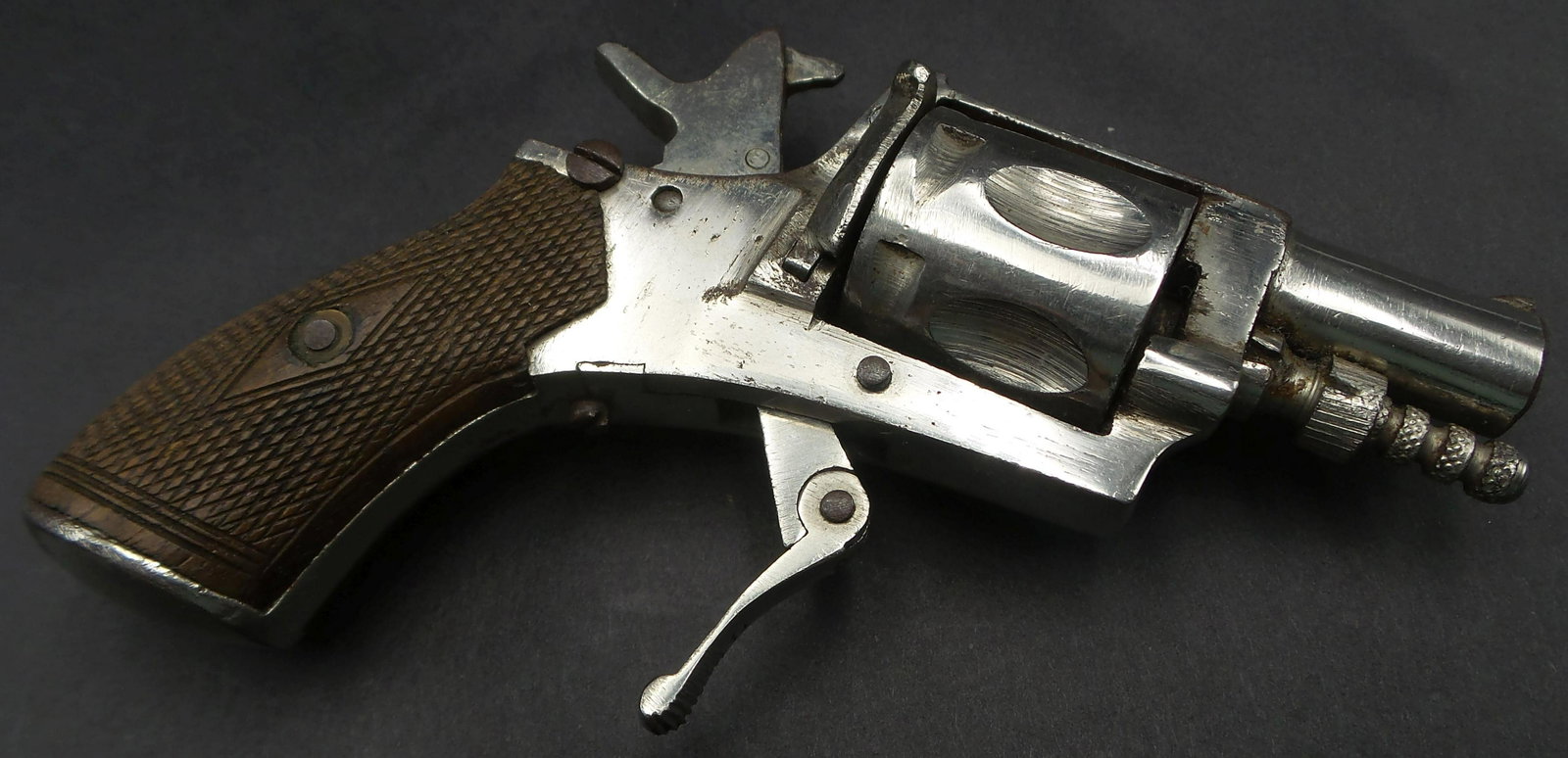 Antique ca. 1870 European "Velo Dog" Revolver Pistol/Gun: Good antique condition according to age. All parts are there. The hammer responds to trigger pulling but doesn't cock. Probably, the spring blade needs to be replaced. The plastic grip handles sit tig