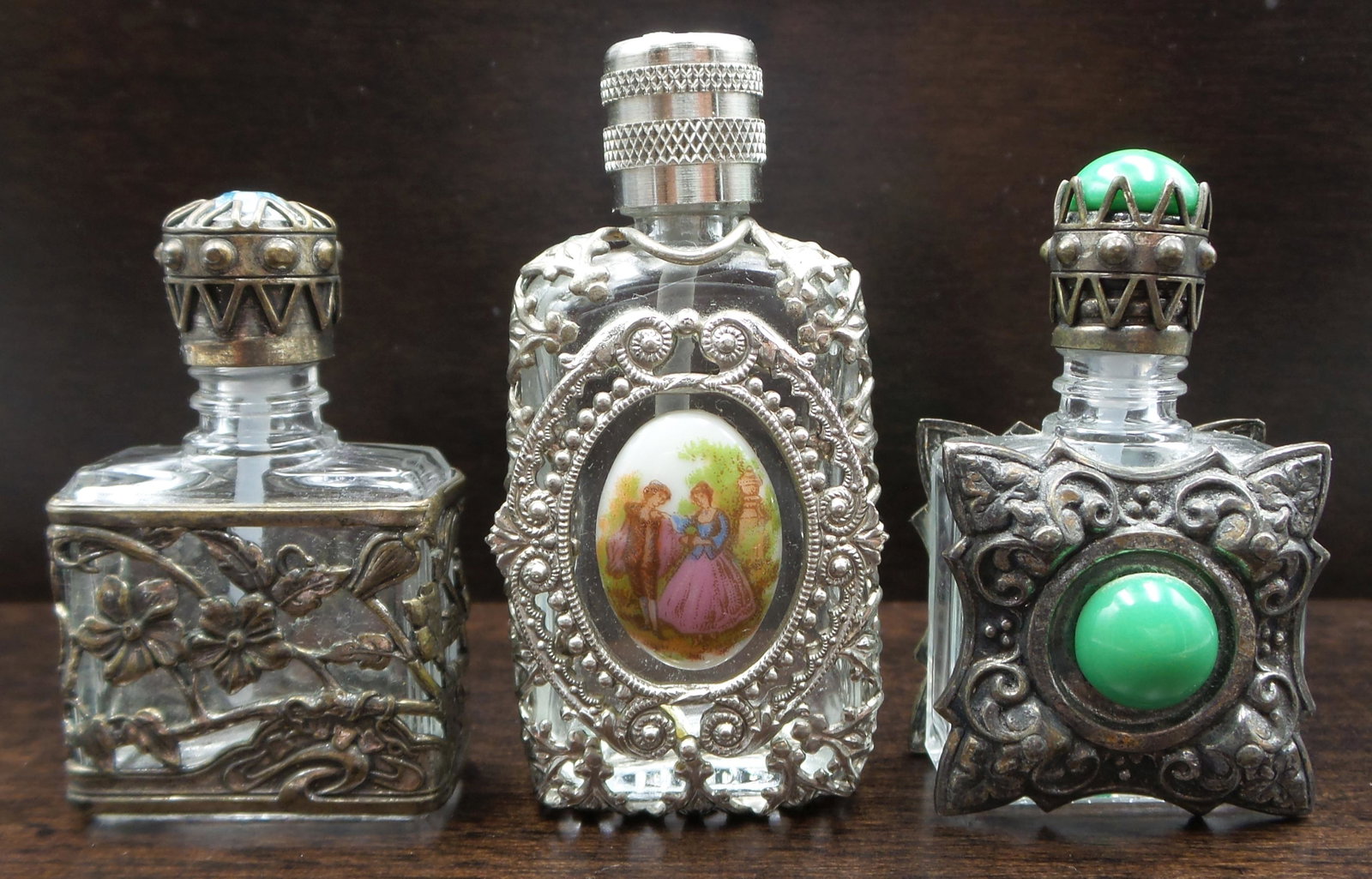 Lot of 3 Small Vintage French Glass & Silver Metal Perfume Bottles - Limoges: Great set! The tallest bottle has a hand painted oval Limoges porcelain plaque and measures approx. 2 1/4" high. The other two bottles feature gemstones and ornate silver metal applications and are si