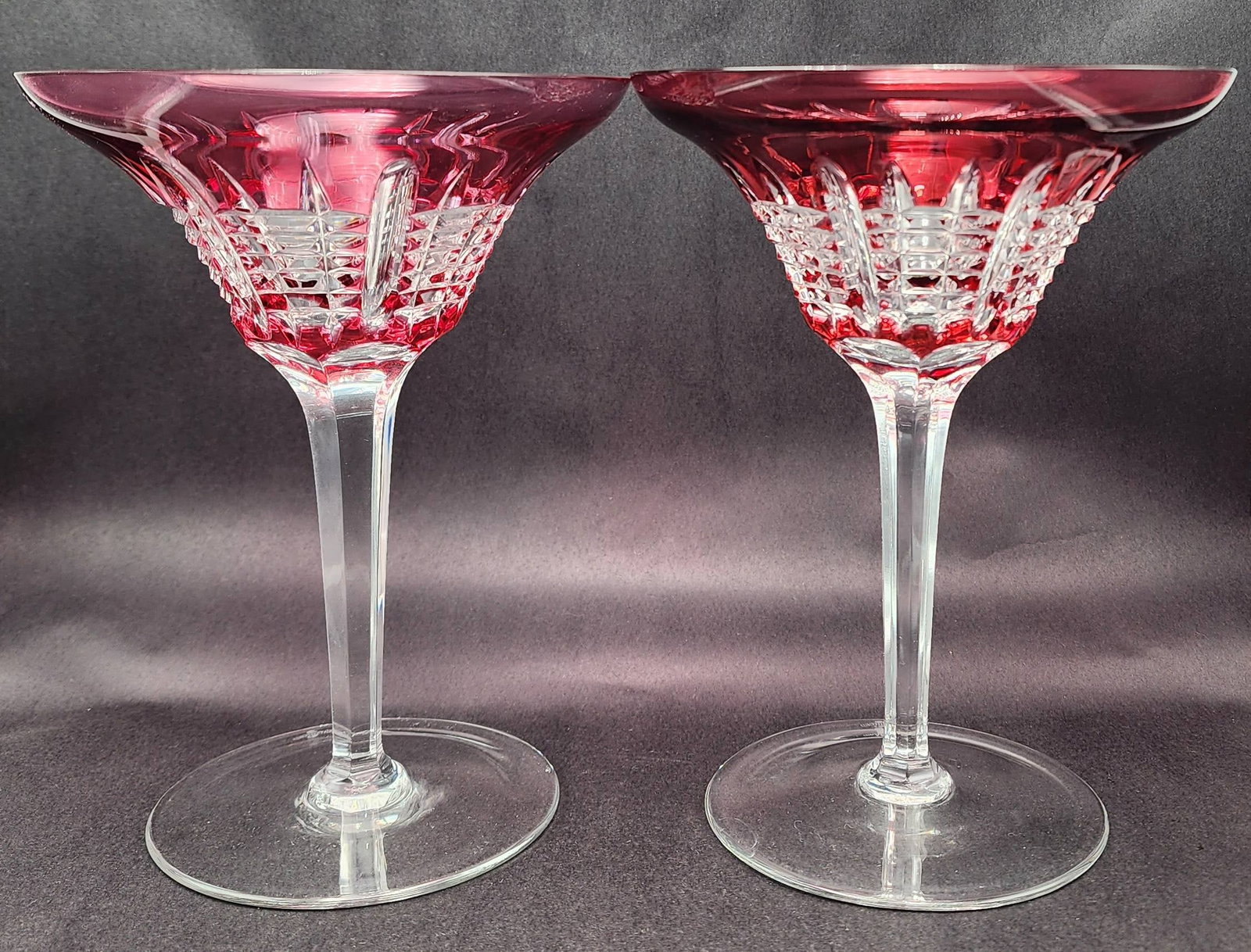 Pair of Vintage WATERFORD Red Cut-to-Clear Crystal Martini Glasses: Beautiful pieces in very good vintage condition; no chips, cracks, or repairs. Each measures approx. 7 1/4" high x 5 1/2" in diameter. Signed on the bottom.
