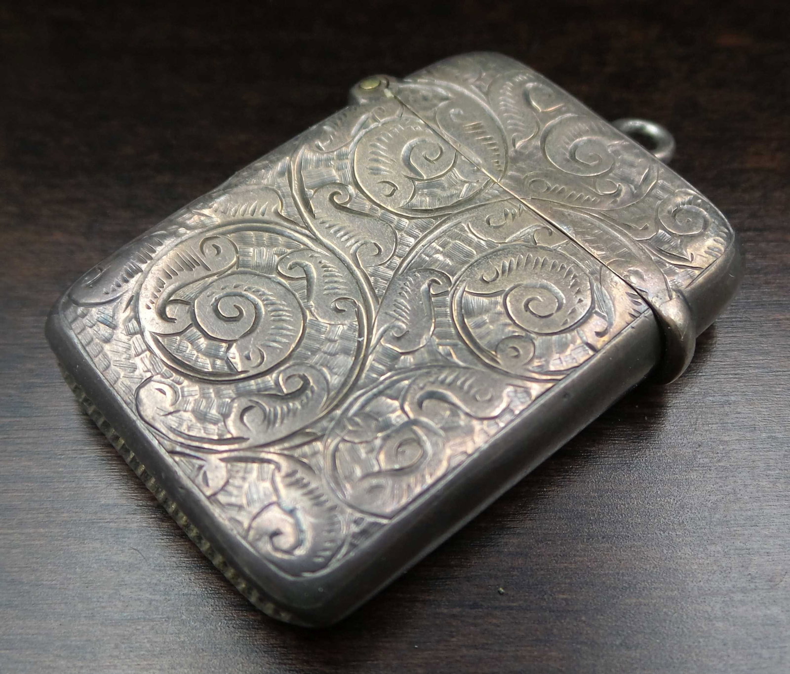 Early 1900s British Sterling Silver Match Safe Pendant: Good antique condition with some patina and wear according to age. Measures approx. 1 5/8" long x 1" wide and weighs ca. 10.7 grams. Fully hallmarked.