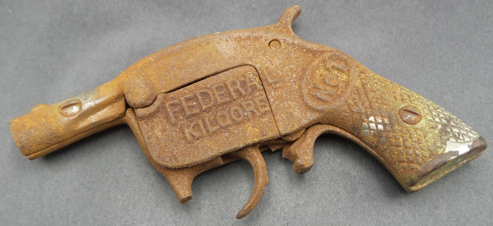 Vintage 1920s FEDERAL KILGORE No. 1 Cast Iron Cap Gun Toy: Missing part of the trigger guard. Corrosion according to age. Measures approx. 5 1/4" long. Spring is there and seems to work but trigger is stuck. Needs restoration.