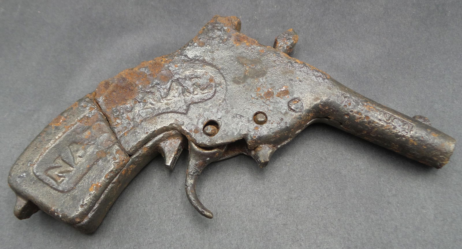 Antique 1911 NATIONAL Cast Iron Cap Gun Toy: Missing the spring and part of the trigger guard. Corrosion according to age. Doesn't currently work. Measures approx. 5" long.