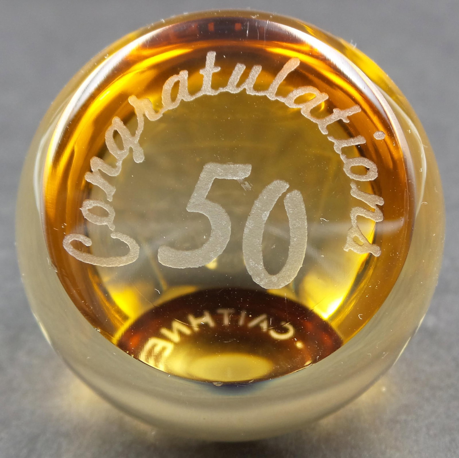 Vintage CAITHNESS Scotland 50th Anniversary Champagne Art Glass Paperweight: Very good vintage condition with no chips, cracks, or repairs. Measures approx. 1 3/4" in diameter (at the widest). Signed on the bottom.