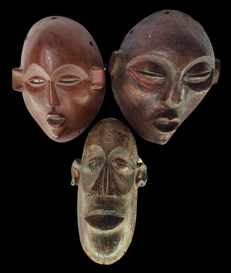 Lot of 3 Vintage African Hand Carved Wood Masks: The tallest piece measures approx. 9" long x 5" wide, the largest approx. 8 1/2" high x 7 1/2" wide. Good vintage condition. Minor wear.
