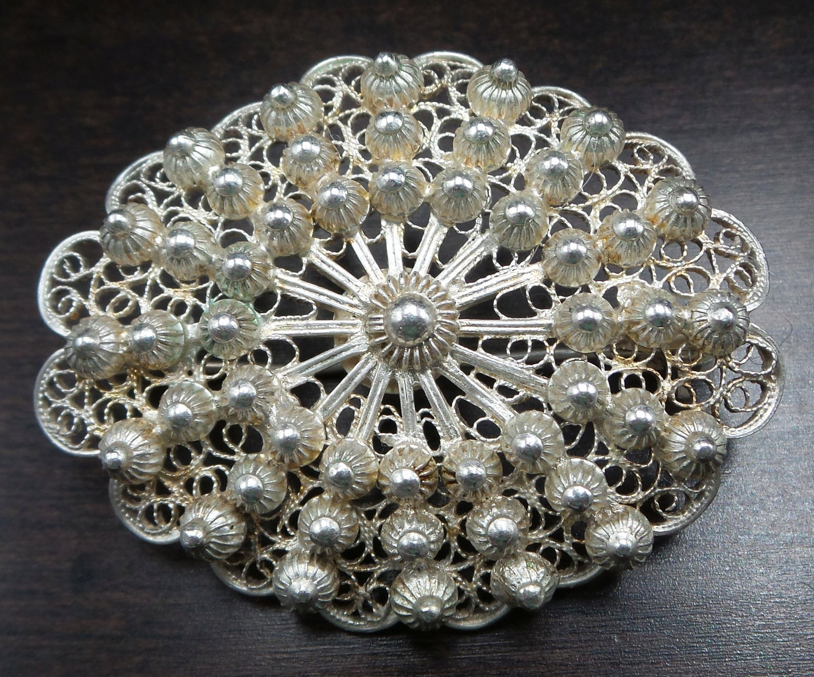 Vintage Italian 800 Silver Filigree Flower Designer Brooch: This handmade piece was crafted around the 1940s in Italy. It is oval, features different filigree techniques, and measures approx. 1 5/8" long x 1 1/4" wide. Its weight is ca. 8.8 grams. Very good vi