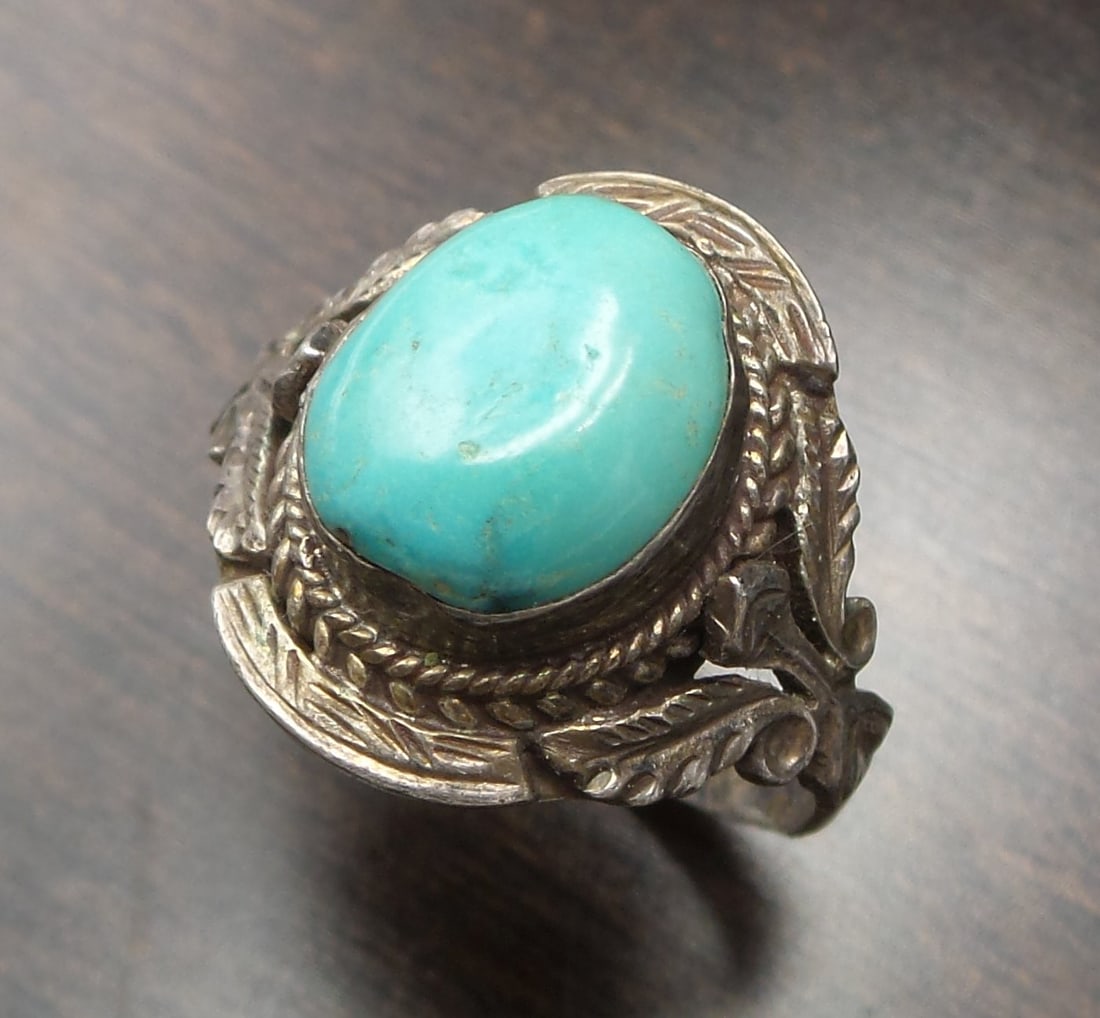 Vintage Native American Sterling Silver & Turquoise Ring: This beautiful handmade Sterling Silver ring is in very good vintage condition and weighs ca. 4.1 grams. Ring size is 8 3/4. Marked "925" for Sterling Silver.