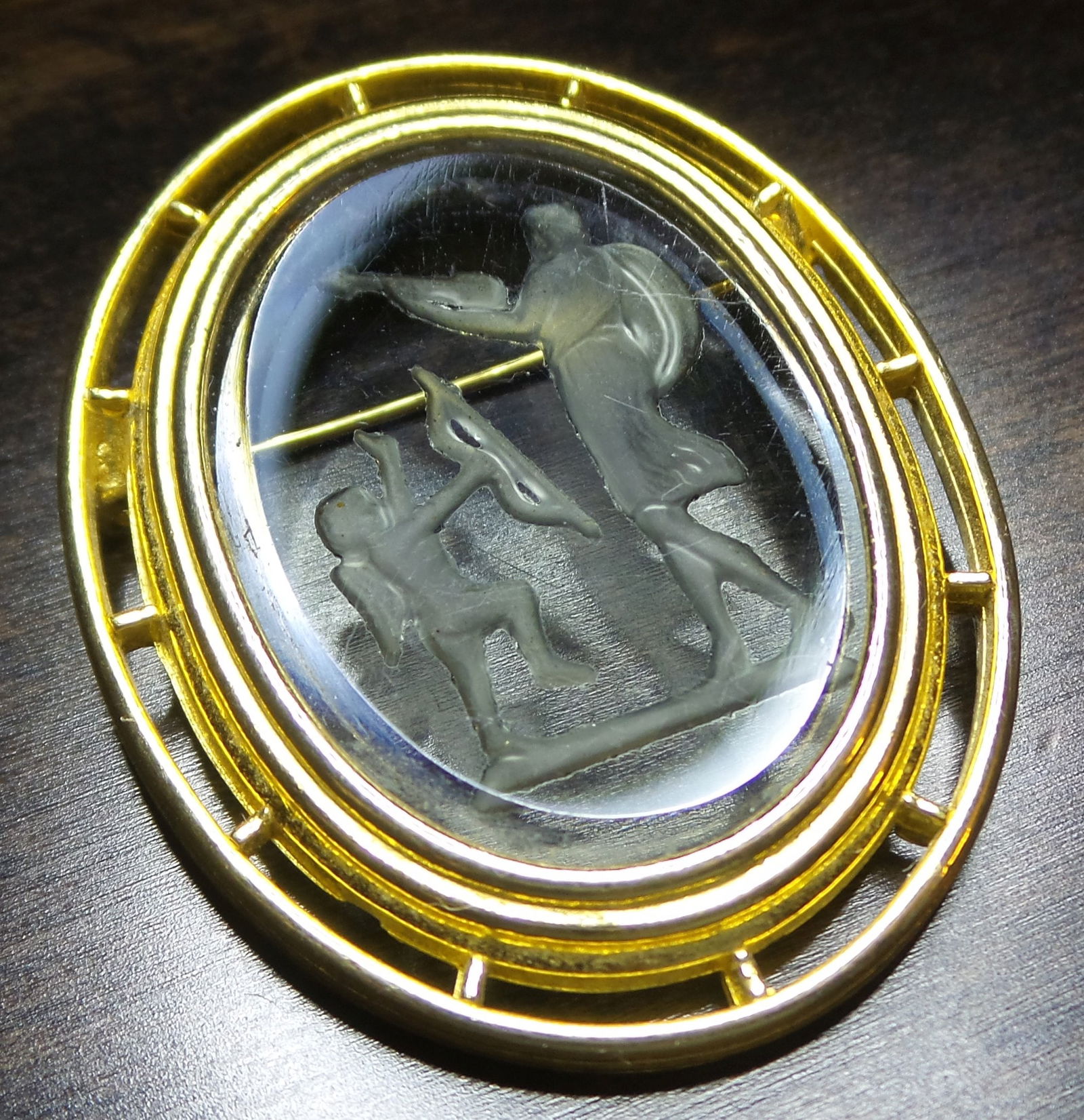 Rare Vintage Gold Plated Metal & Glass Intaglio Greek/Roman Mythology Brooch: This unusual piece was likely made in the 1950s and features a hand-cut Greek/Roman mythology scene in a beveled oval glass plaque set in a gold plated pierced metal frame. Very good vintage condition