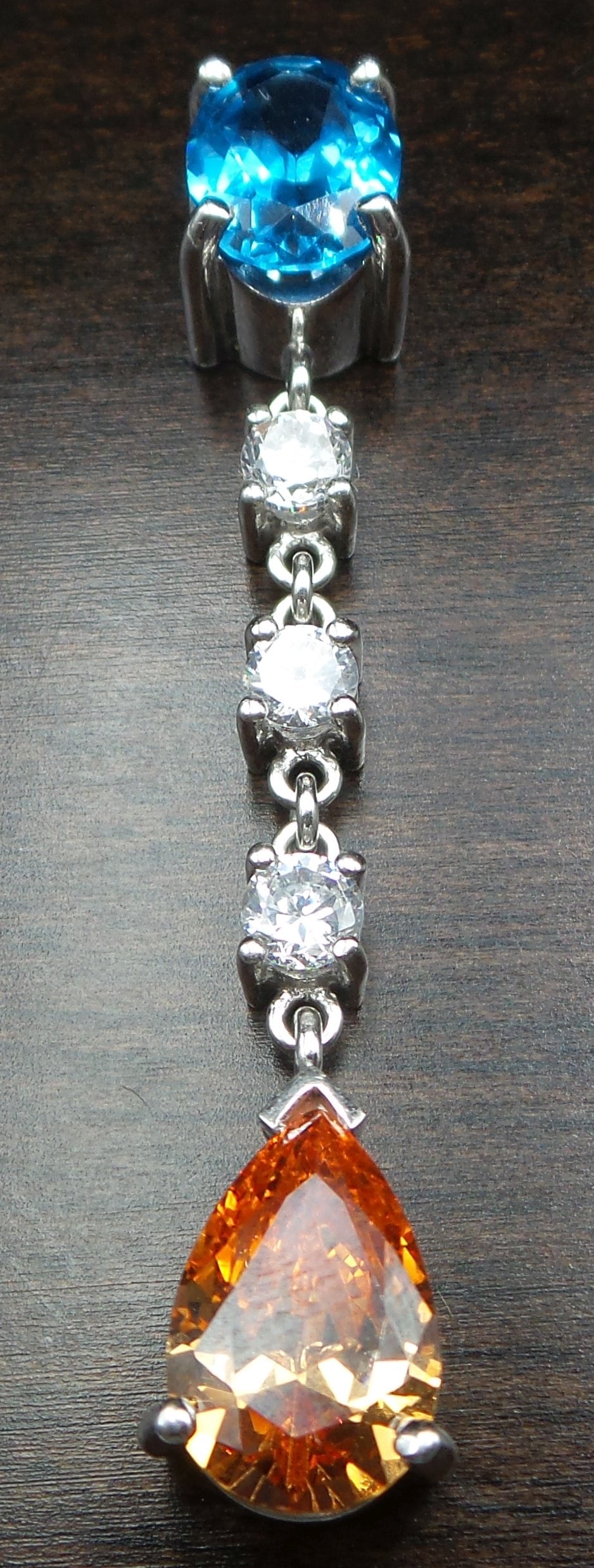 Vintage Sterling Silver & Gemstone Chandelier Designer Pendant: This unusual piece was made around the 1990s, probably in Europe. It features several pronged bezels connected through chains with colored and transparent Rhinestones. The piece measures approx. 2" lo