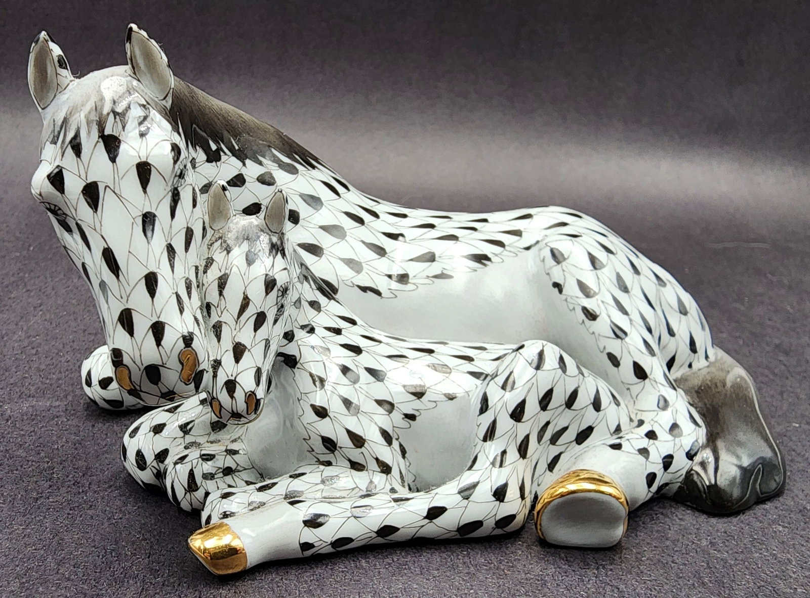 Vintage HEREND Hungary Porcelain Horses Figurine: Very good vintage condition; no chips, cracks, or repairs. Signed on the bottom. Measures approx. 5 1/2" long x 3 1/2" wide x 3" high.