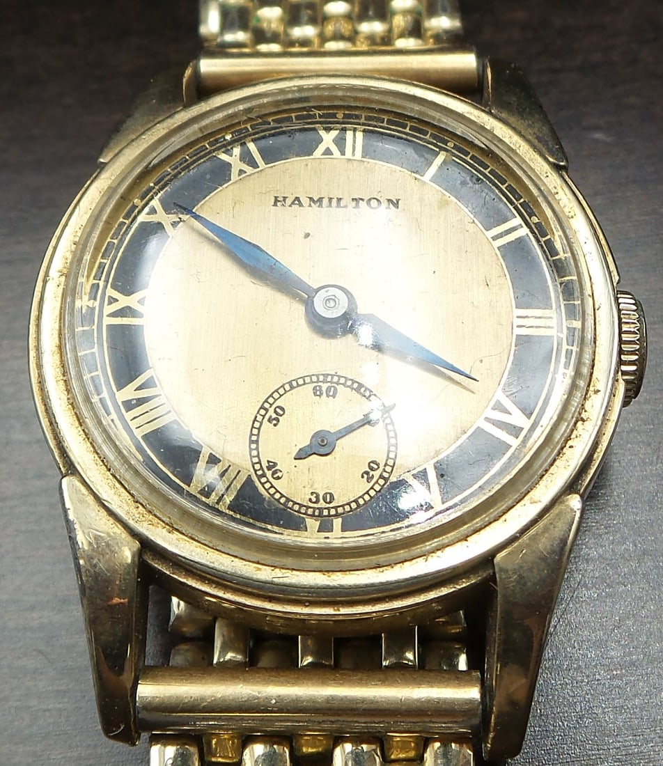 Vintage HAMILTON 10K Gold Filled Wind-Up Wristwatch: Very cool piece from the 1970s in good working condition with wear according to age. 28mm case diameter, 10K gold filled case and band.